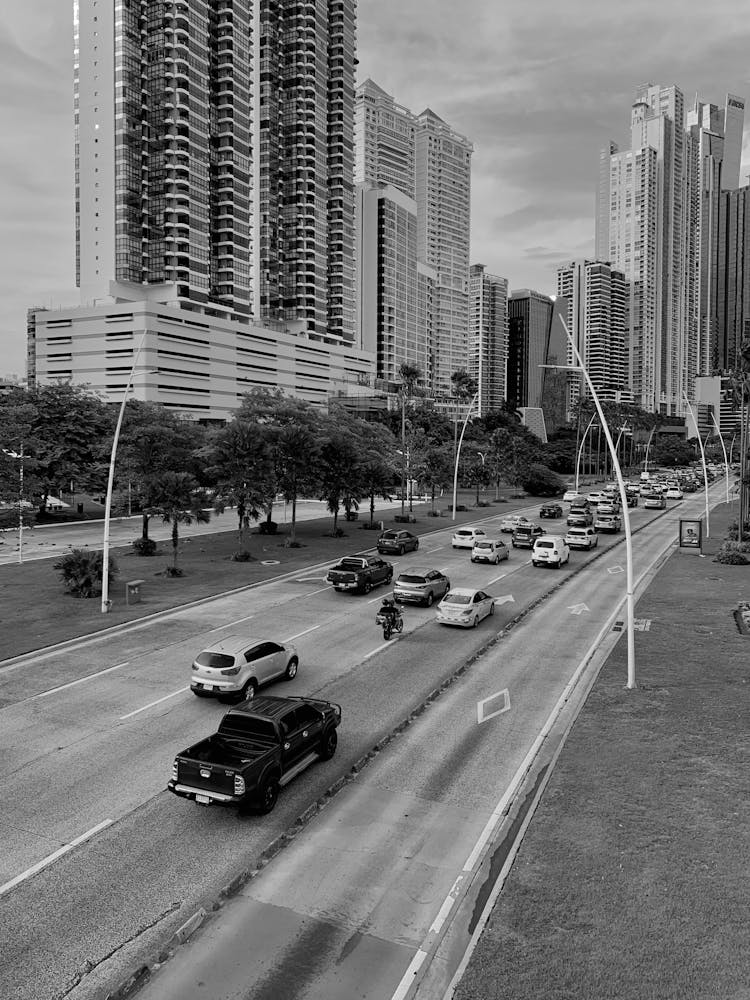 Black And White Photo Of A City Road 