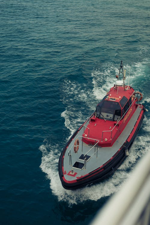 Red Motor Yacht Sailing