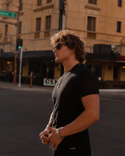 Man in Black T-shirt and Sunglasses on Street