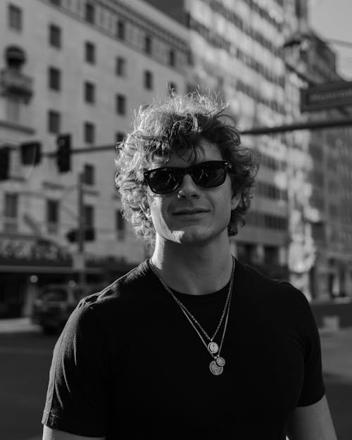 Man in Sunglasses and with Curly Hair