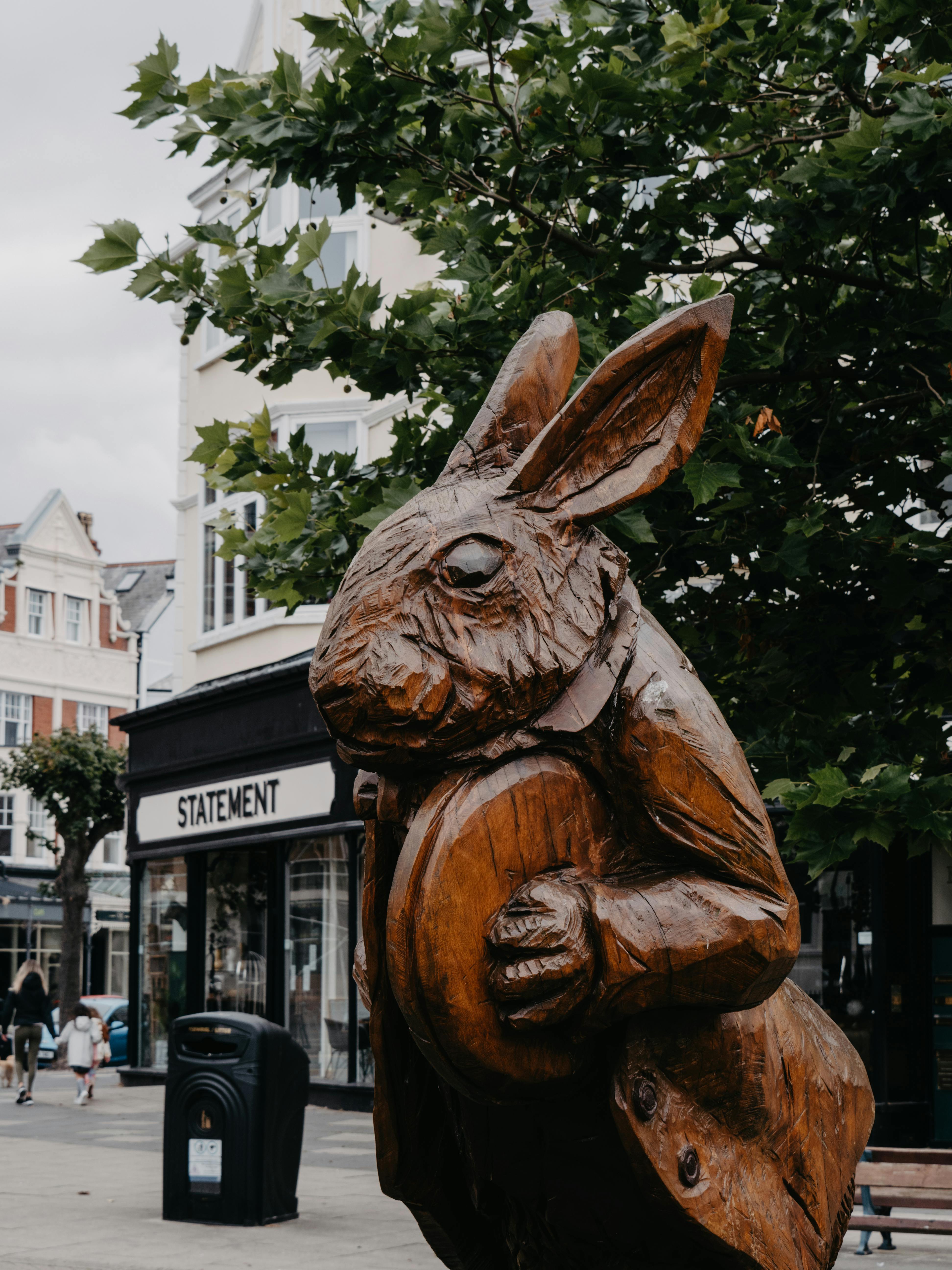 Wooden rabbit sculpture inspired by Alice in Wonderland in Llandudno, Wales.