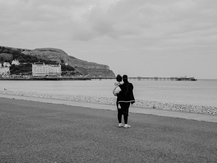 Parent With Child On Sea Shore