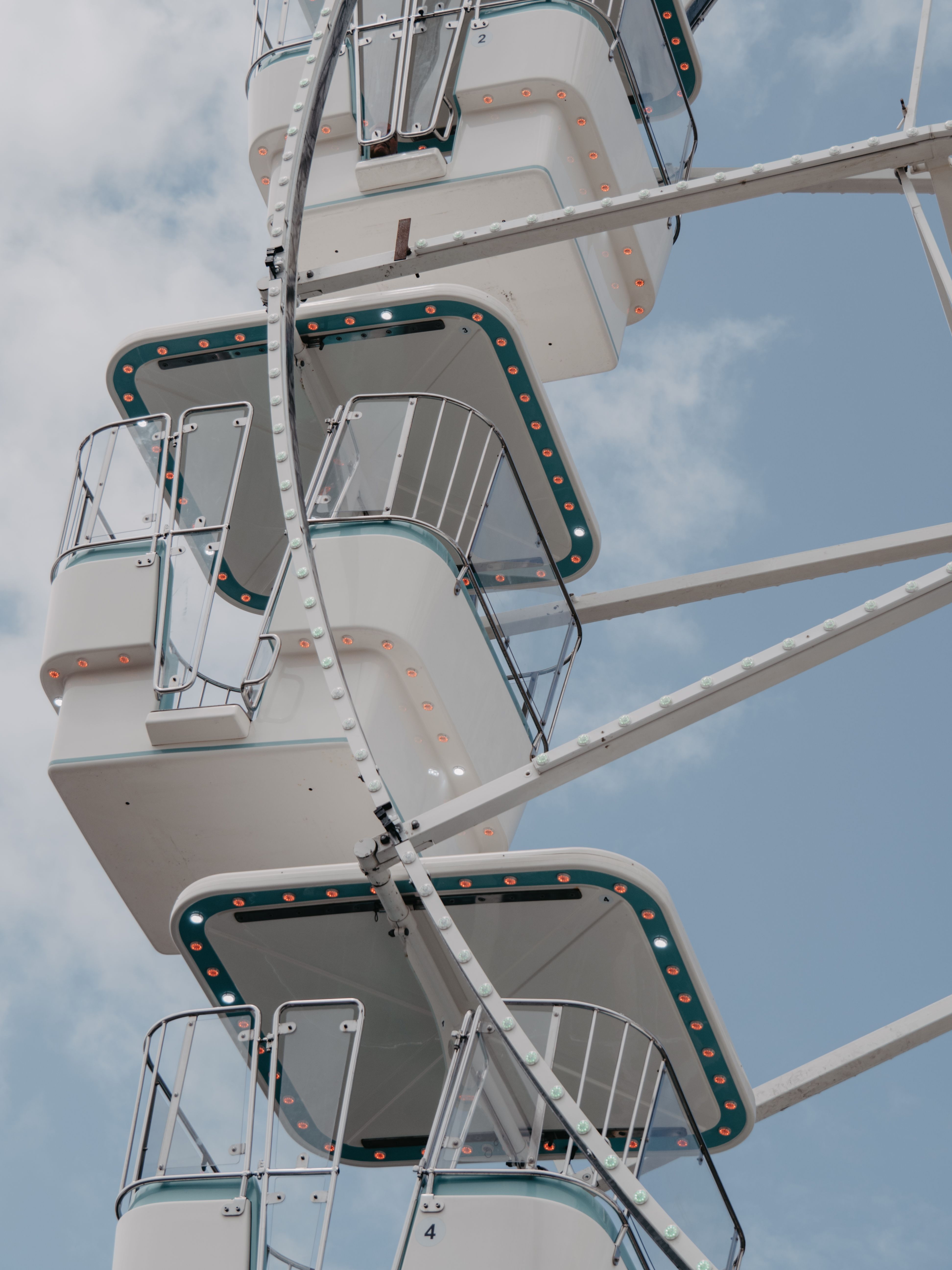 Ferris wheel with passenger cabins in amusement park · Free Stock Photo