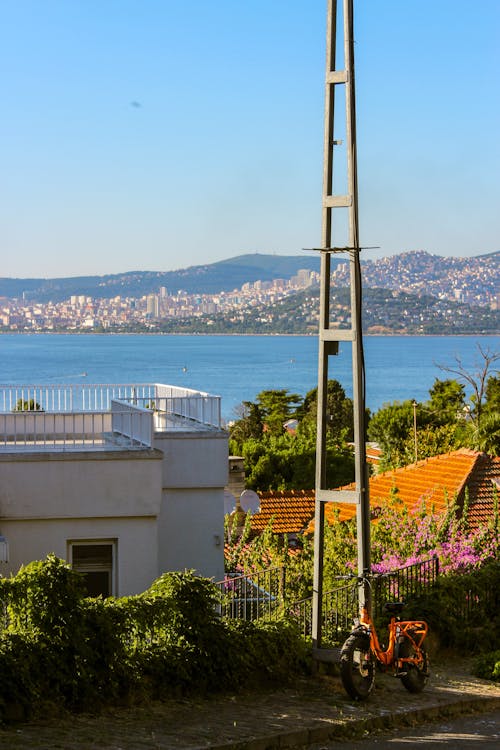 Electricity Pole Among House Buildings