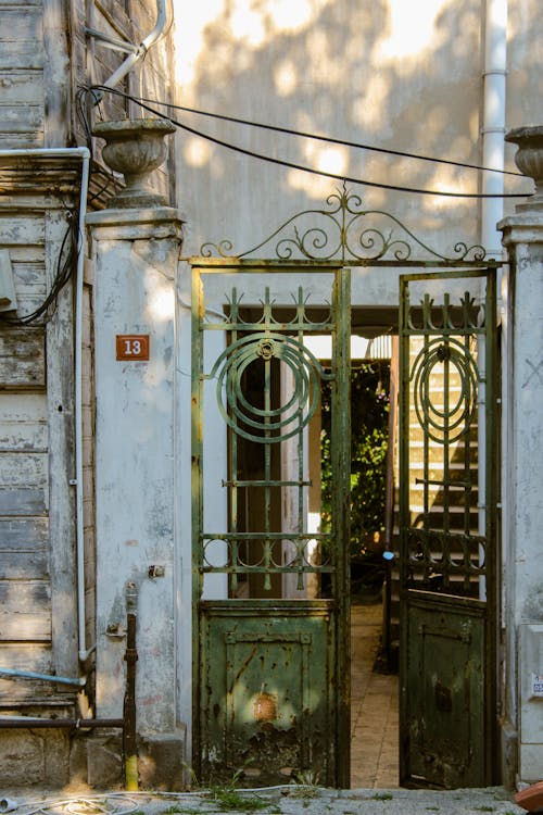 Green Metal Door into Yard