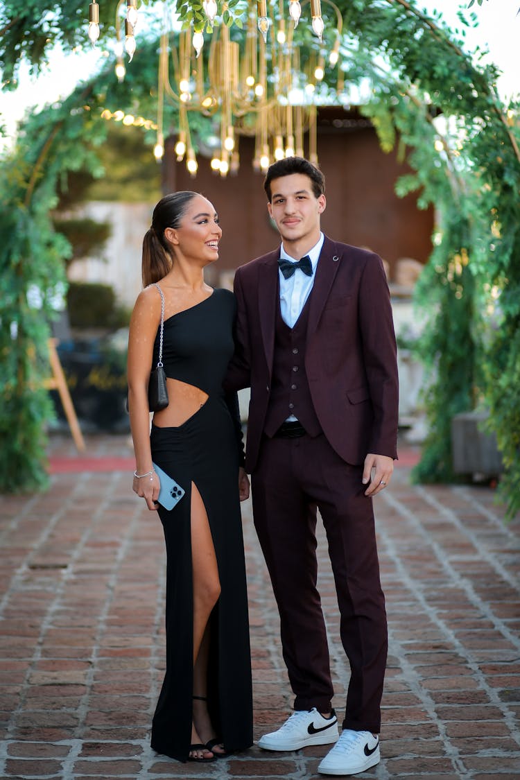 Elegant Couple On A Garden Party