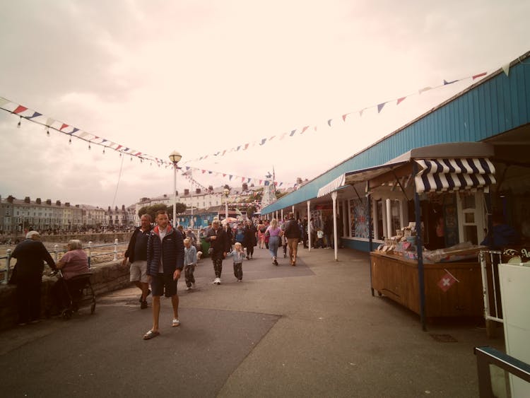 People On A Market In Harbor