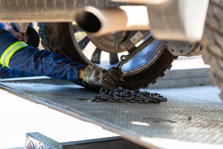 Arm Of A Mechanic Repairing A Car