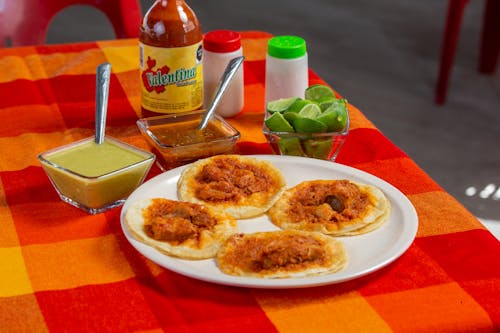 Ready-to-Eat Tacos with Limes and Two Dipping Sauces