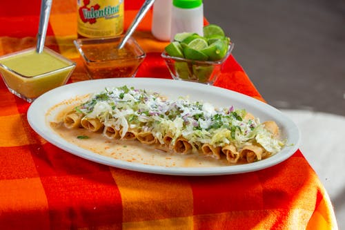 Plate of Mexican Taquitos with Dipping Sauces