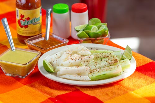 Plate of Jicamas with Chili Powder and Dipping Sauces