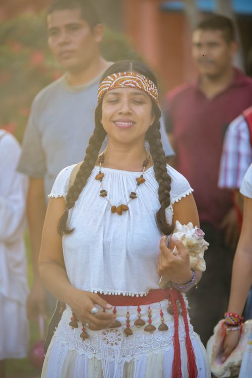 Free A woman in traditional attire joyfully participates in a festival parade outdoors. Stock Photo