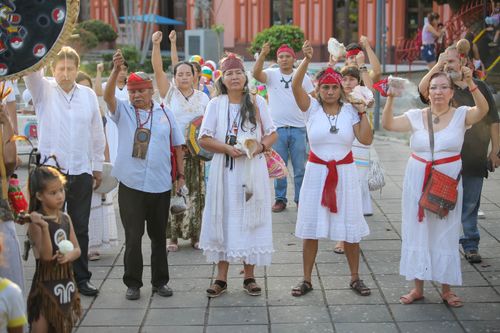 Free A group of people participating in a traditional cultural ritual outdoors. Stock Photo