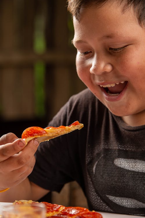 Smiling Boy with Pizza