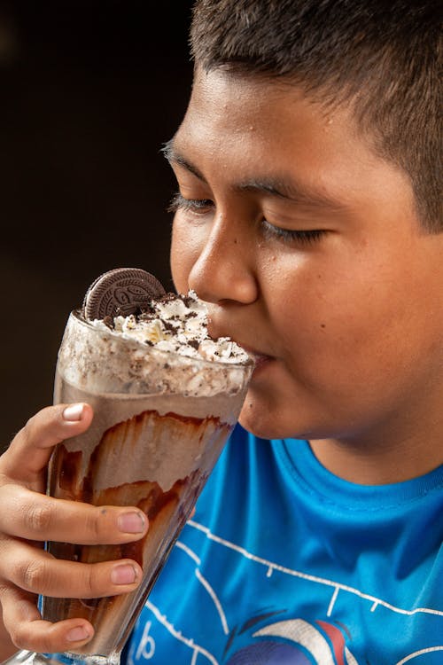 Boy Drinking Oreo Milkshake