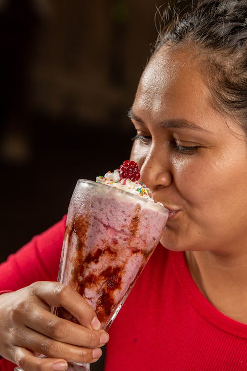 Woman Drinking Strawberry Cocktail 