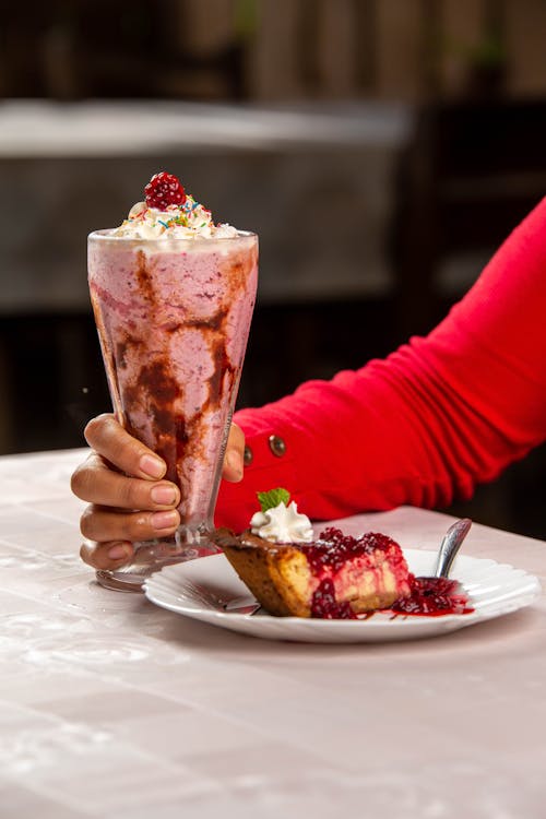 Cheesecake with Strawberry Cocktail Served in a Restaurant