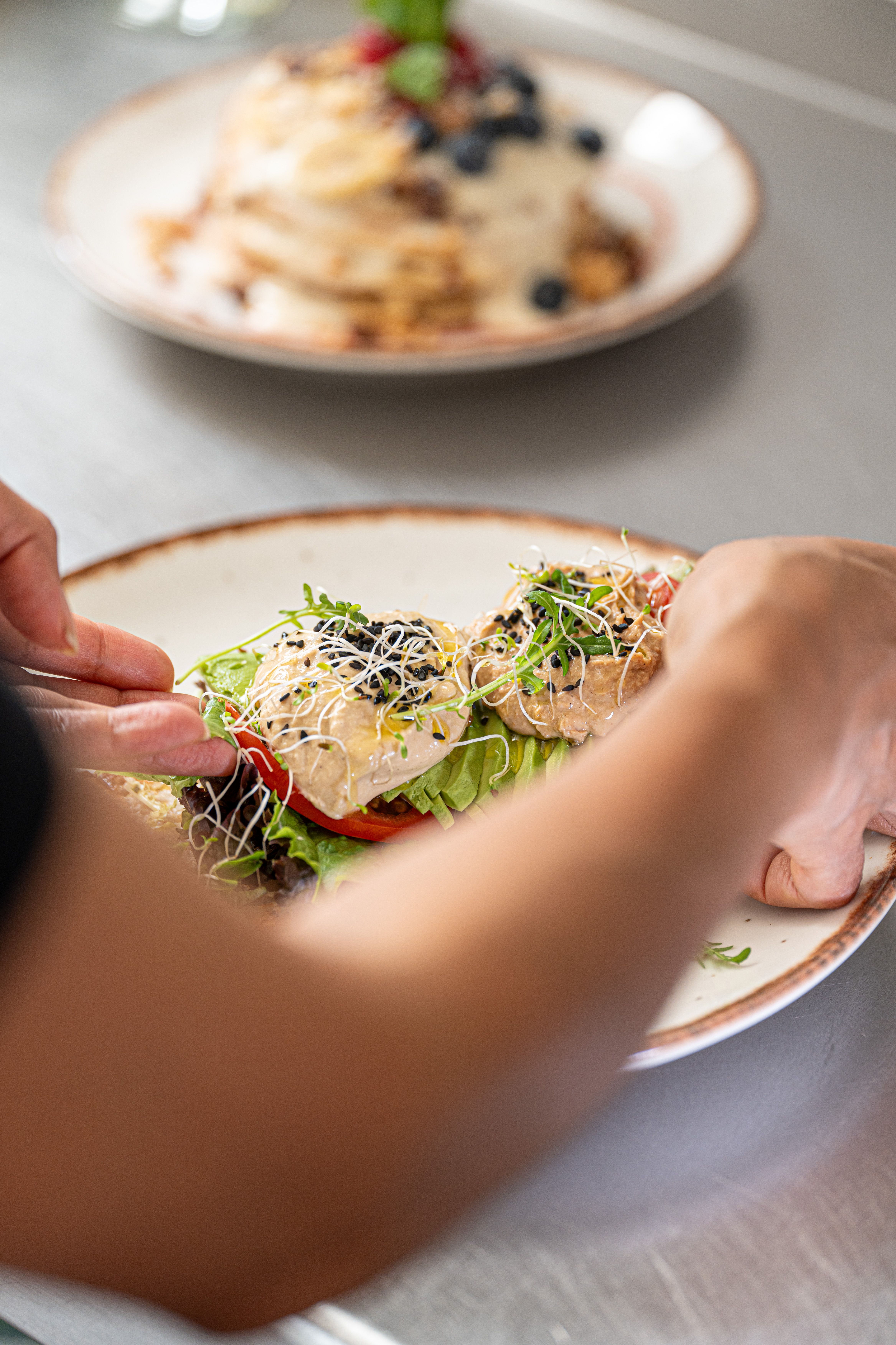 Chef plating a South Indian breakfast dish