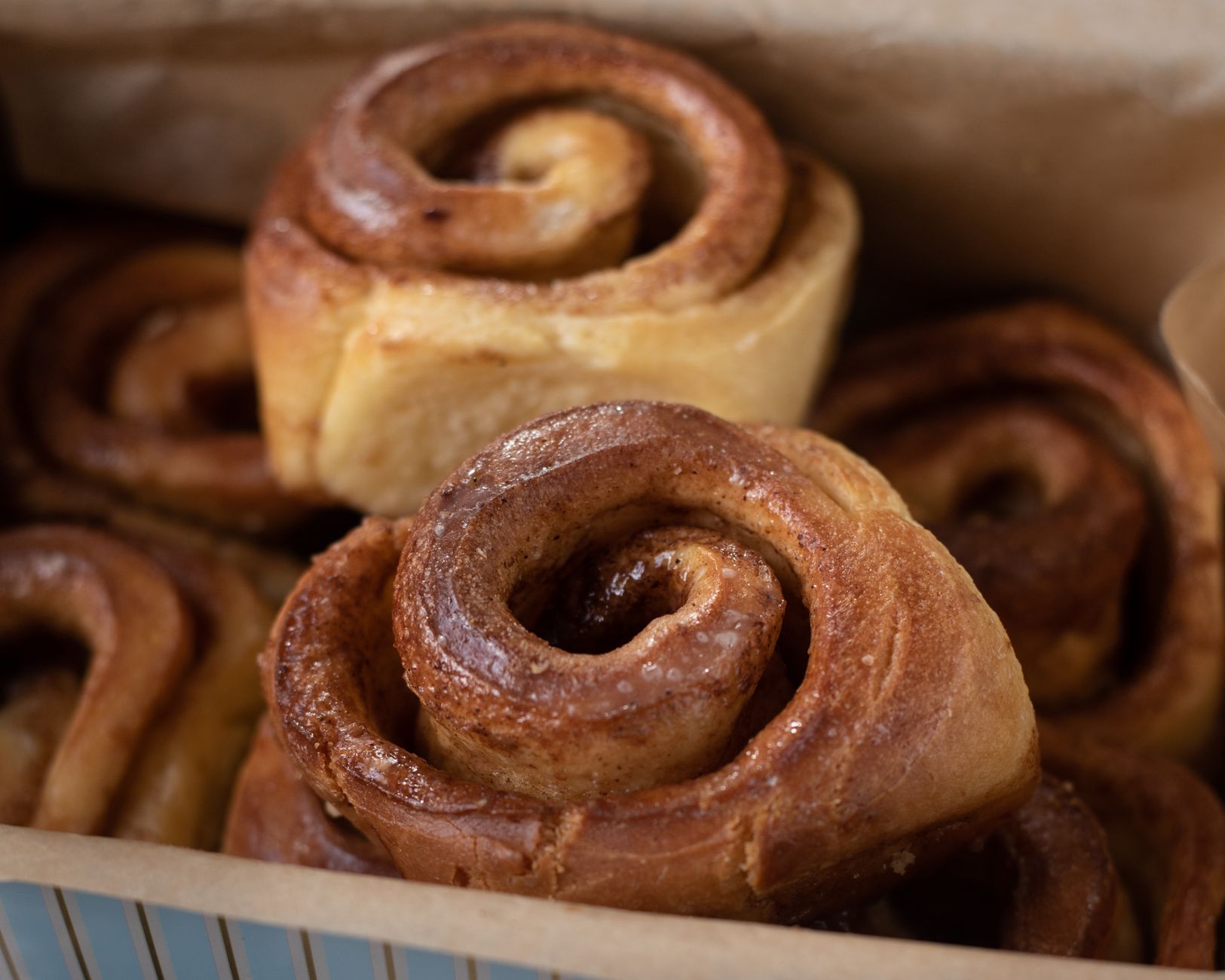 Golden double swirl cinnamon buns fresh out of oven