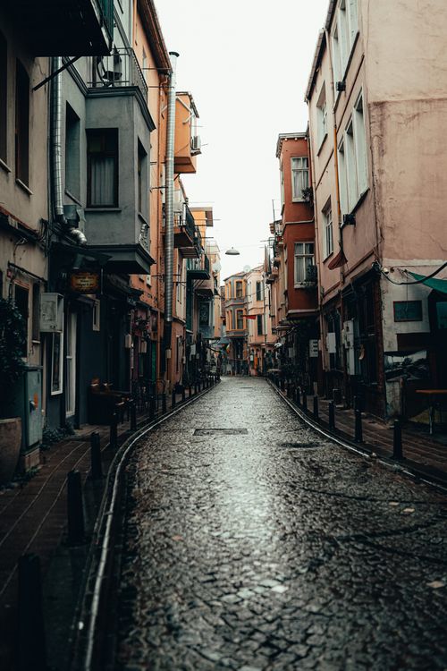 Free Charming narrow street in Istanbul with colorful buildings and cobblestone path. Stock Photo
