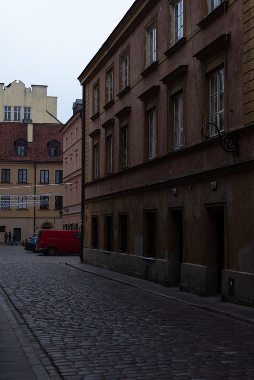 Free Quiet cobblestone street lined with historic buildings in an old town setting. Stock Photo