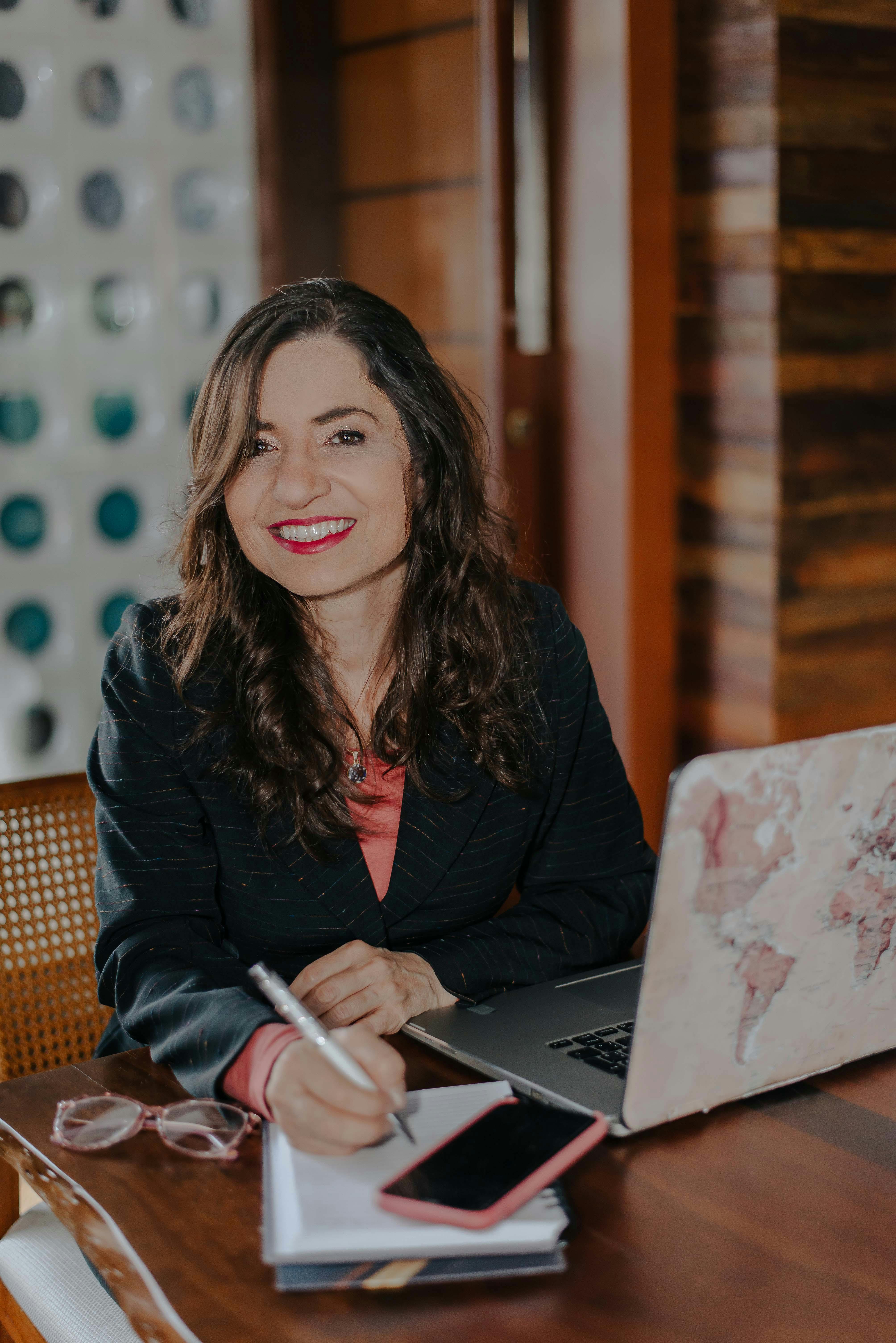 free-photo-of-a-woman-smiling-while-sitt