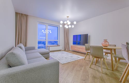 Grey Fabric Sectional Sofa on Brown Wooden Floor