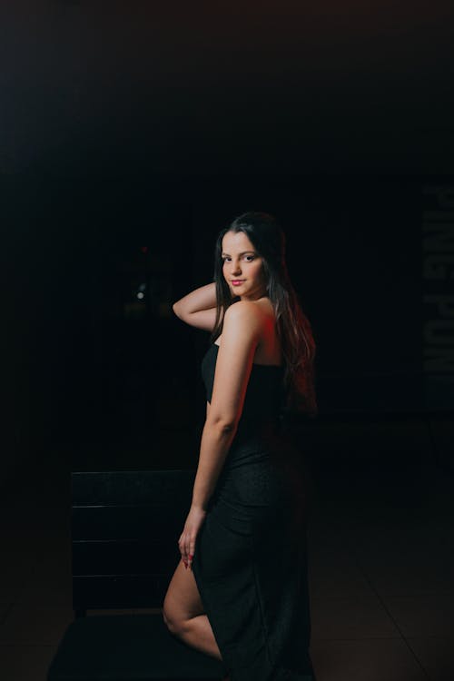 Young Woman Posing in an Elegant Black Dress