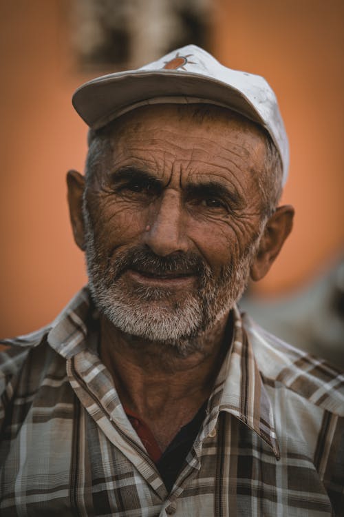 Portrait of an elderly Man Wearing a Cap 