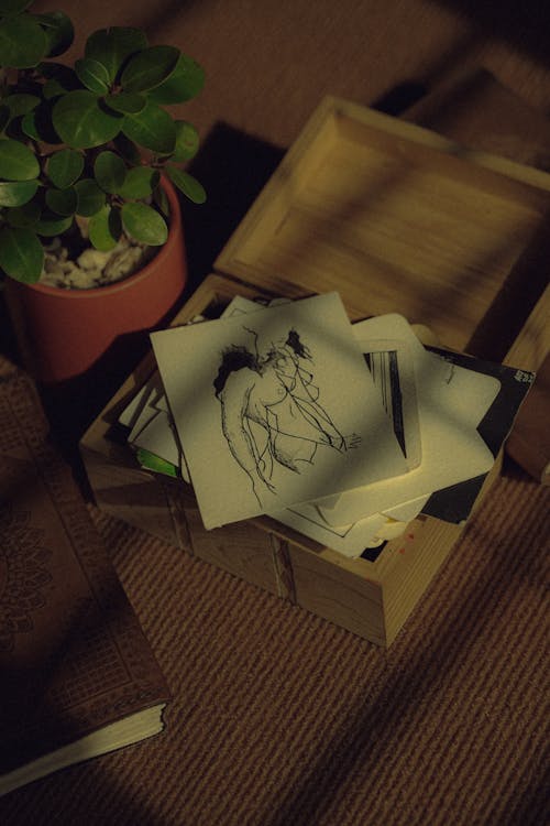 A wooden box with a drawing of a horse on it
