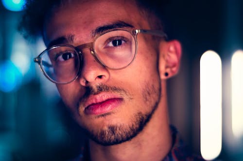 Free Close-Up Photo of Man Wearing Eyeglasses Stock Photo