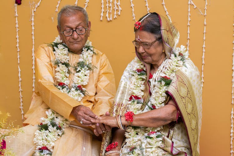 Elderly Man And Woman In Traditional Clothing On Celebration