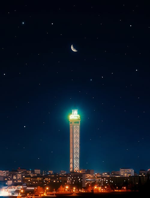 Crescent Moon Over the Illuminated Minaret of the Sidi Achour Mosque in Nabeul, Tunisia