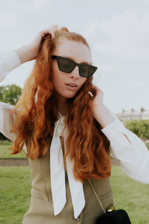 Redhead Woman Posing in Sunglasses