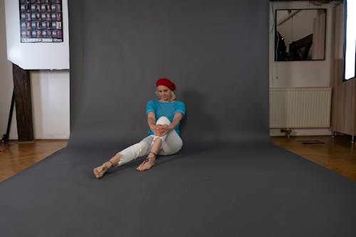 blonde, french barette, barette, red hut, turquoise, white trousers, studio photography