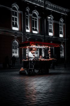 Illuminated food cart in Istanbul's vibrant streets, capturing urban life at night.