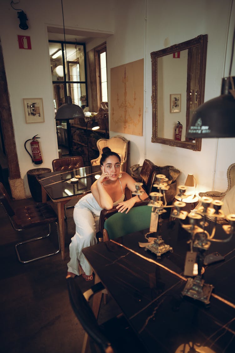 Young Woman Sitting In A Vintage Room 