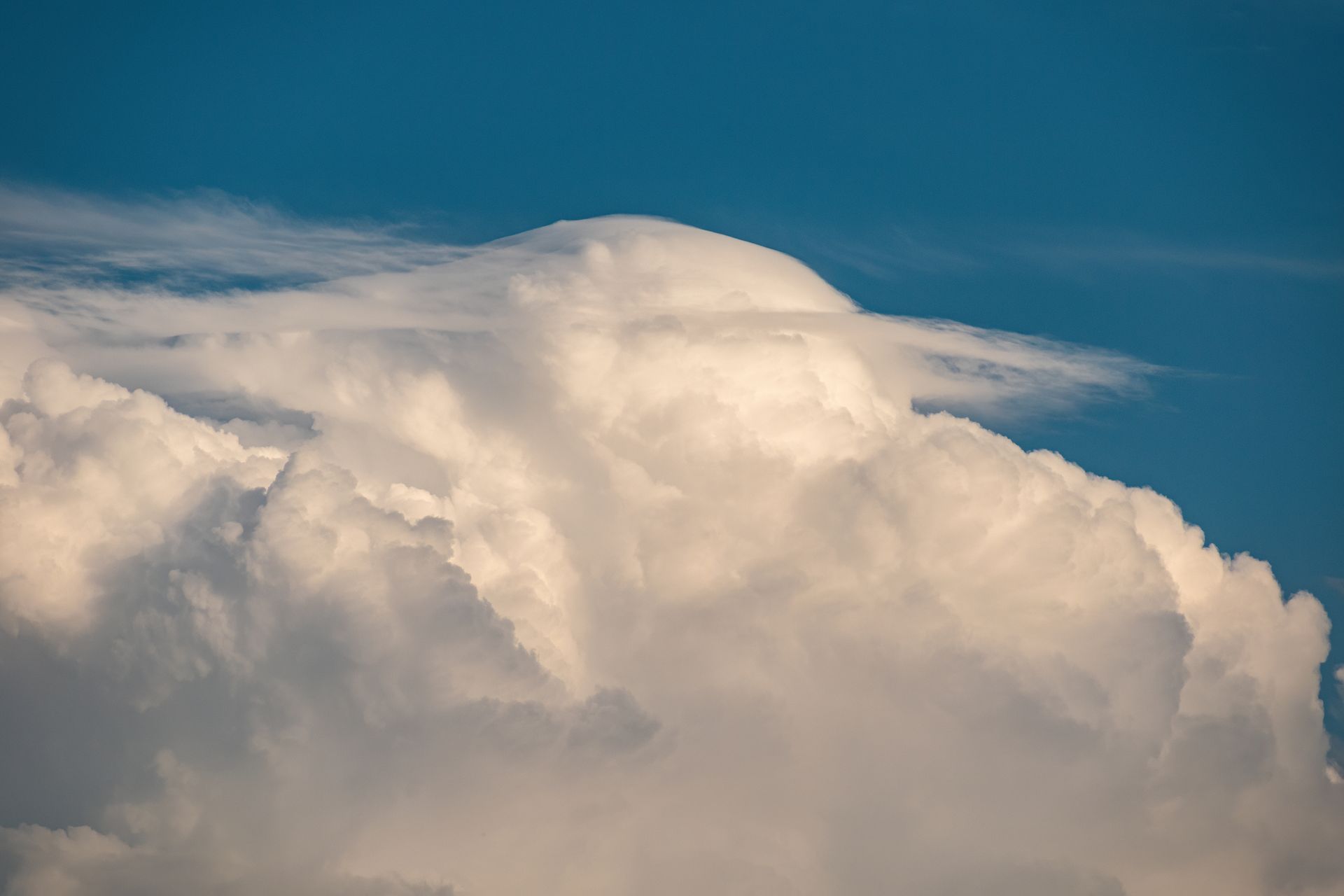 Majestic cumulus clouds in blue sky capturing a serene weather moment.