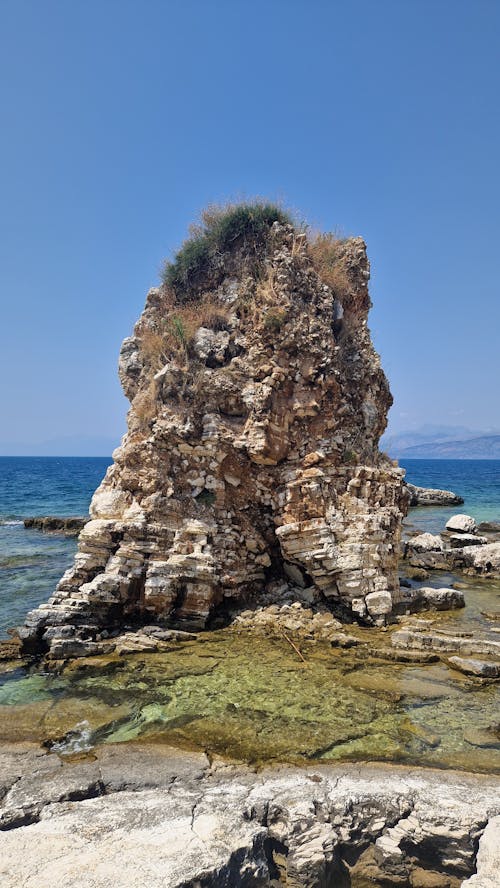 Rock on Seashore near Water