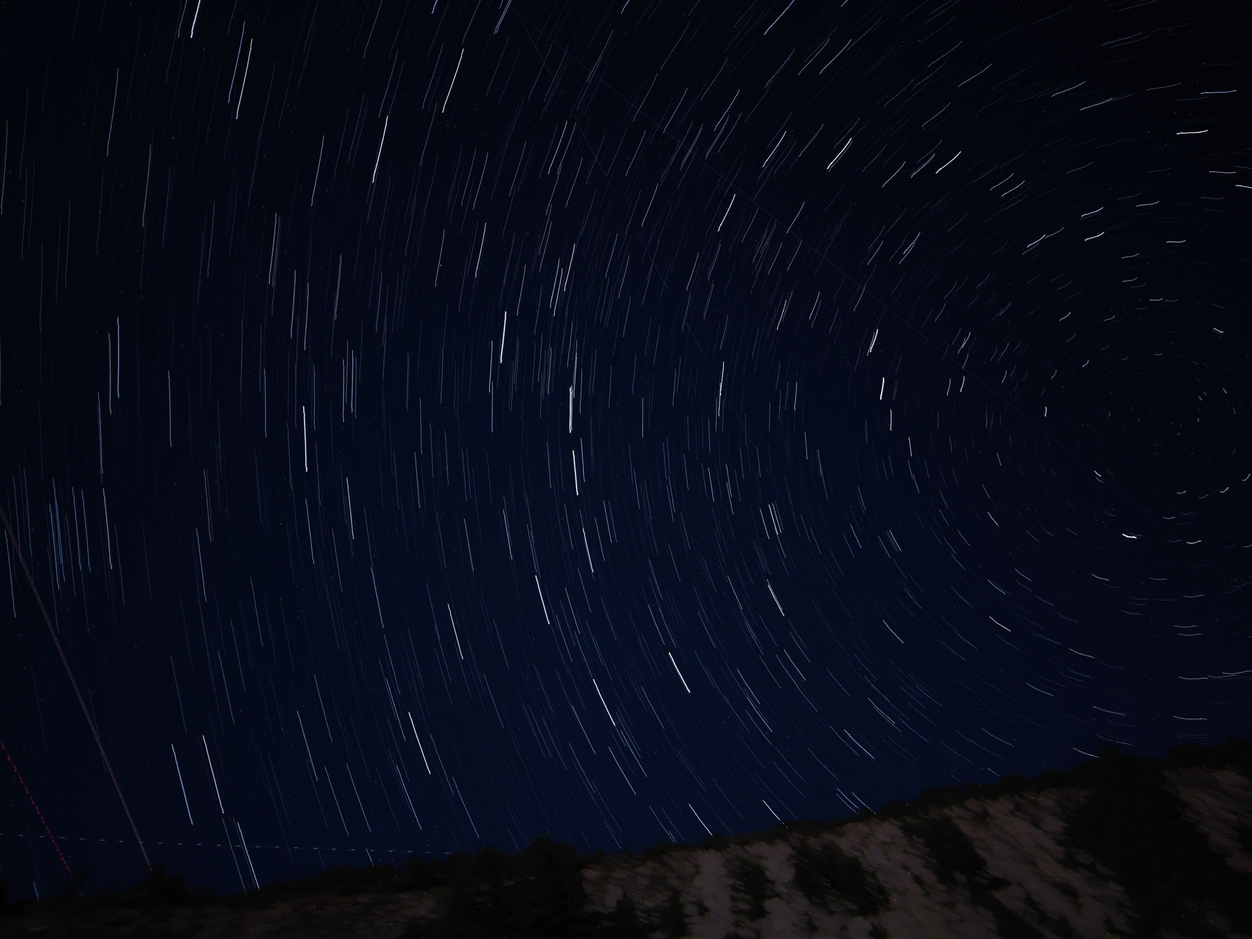 Star trails in the night sky · Free Stock Photo