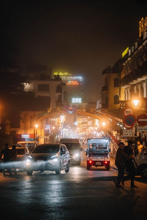 Free Urban night scene with illuminated streets and bustling traffic in a lively city. Stock Photo