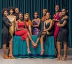 A sophisticated group photo of women dressed in elegant evening gowns, showcasing diversity and style.