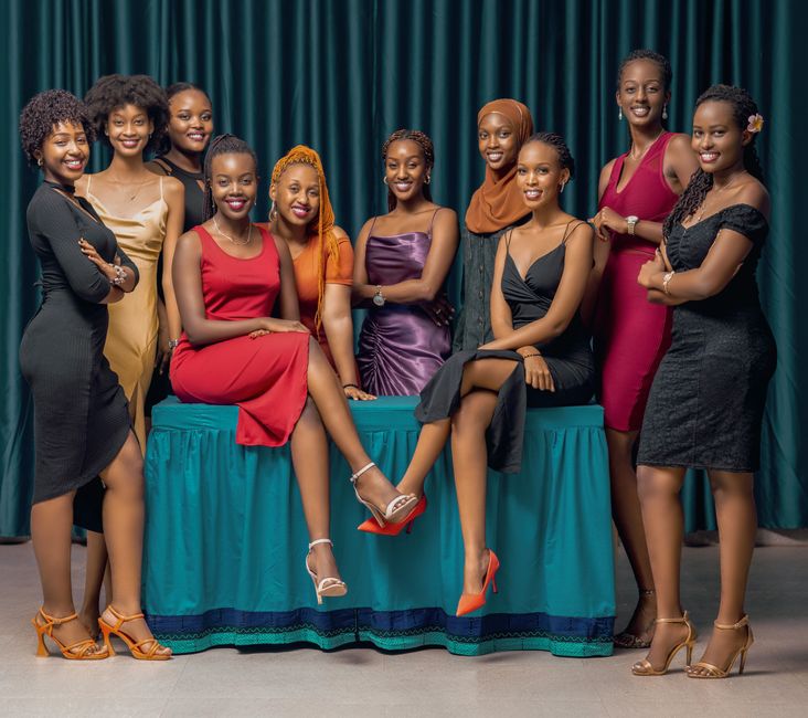 A sophisticated group photo of women dressed in elegant evening gowns, showcasing diversity and style.