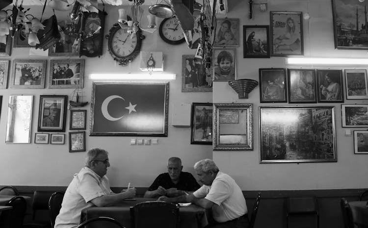 Retirees Playing Card At Bar