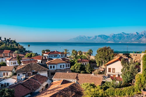 View of Houses on the Shore, Sea and Mountains in Antalya, Turkey 