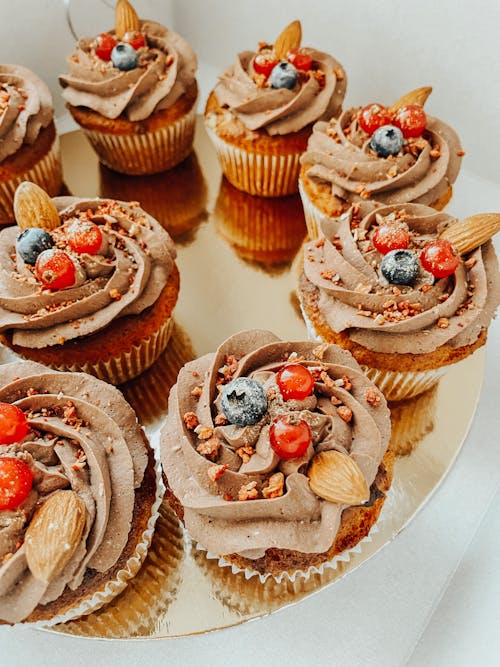 Delicious Cupcakes with Cream on Tray