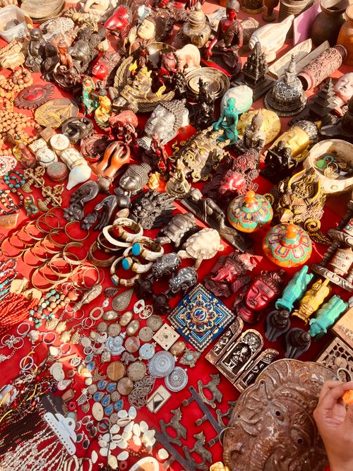 Free A vibrant display of vintage and handmade items at a bustling market stall. Stock Photo