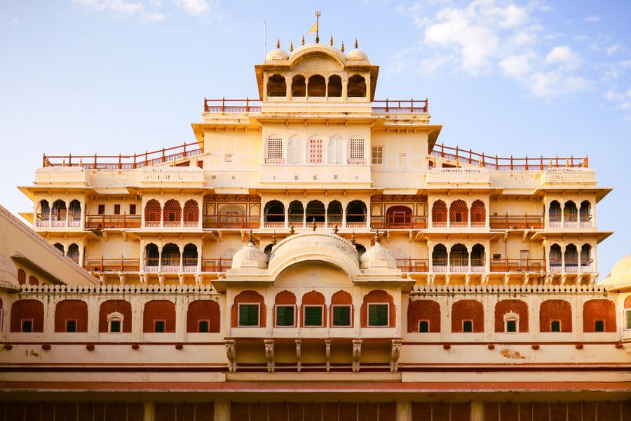 The stunning facade of the Chandra Mahal in Jaipur, showcasing Mughal architecture.