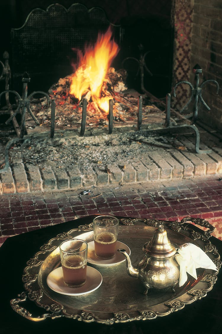 Cups Of Tee By The Fireplace