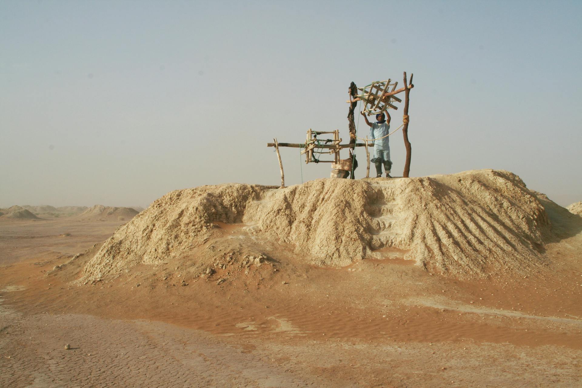 Man Working on Mine Installation on Desert